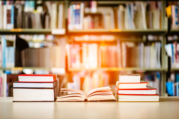 Book stack is placed on the library desk. education background, back to school concept.