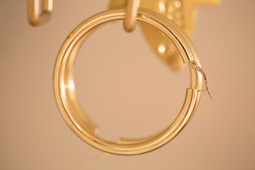 14k gold circle earrings closeup.