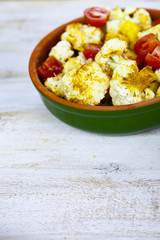Raw vegetables in a ceramic dish