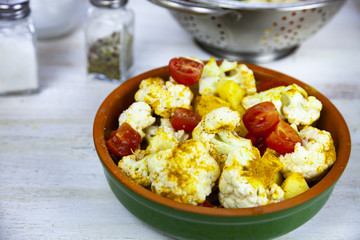 Raw vegetables in a ceramic dish
