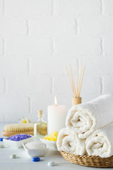 Body care set for peeling. With towel,white lily, sea salt, bath oil, sugar body scrub, massage brush and candle