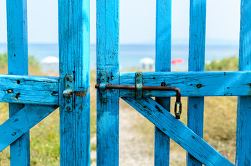 Blue gate unlocked, pathway to the sea