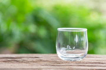 Close up empty drinking glass on wooden table