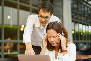 close up call center woman stress or headache with hard working and partner come to help and...