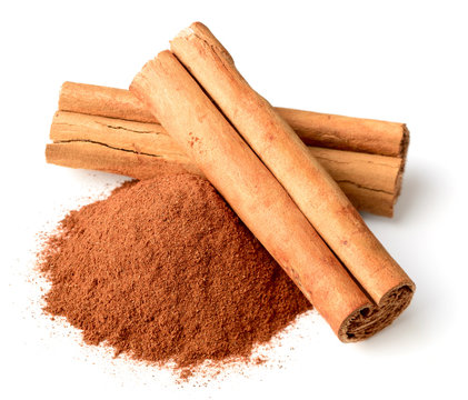 Cinnamon Powder And Sticks Isolated On White