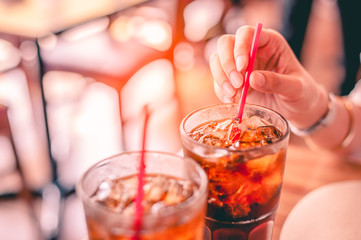 Two glass soft drink with ice in restaurant background