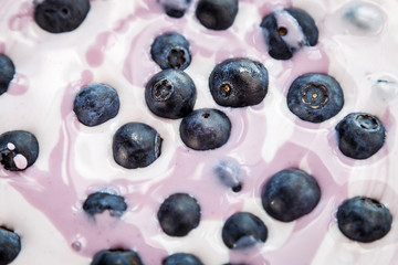 the berries ripe blueberries in yogurt. healthy Breakfast or dessert