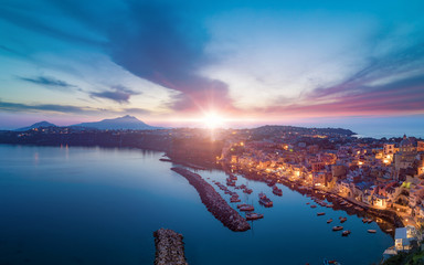 Sunset aerial view of Marina Corricella in Procida island, Italy.