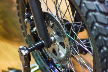 Fototapeta premium close up - wheel spokes and brake disc of a motorcycle