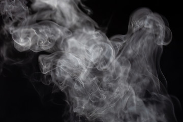 Traditional silver cooking pot with white smoke