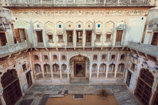 Old house with arches and courtyard, India. Traditional mansion in Rajasthan.