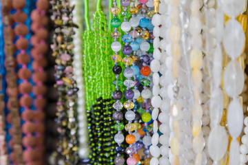 beautiful multicolor beads in necklace form, marvelous colorful beads in necklace form as background, texture.