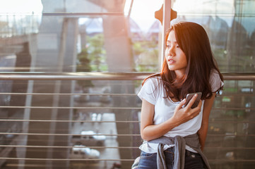 Women are using their smartphones to Flight Checking at airports.airports and technology concept