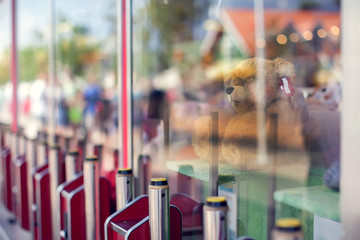 Claw machine in the amusement park of the mall which insert coin and press the control button to...