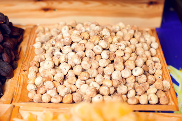 Dried fruit background. Rows of dried dates, apricots,cranberries, pomelos, prunes and figs.