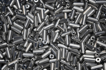The pile of metals rod after turning process .Preform shape materials for manufacturing process.
