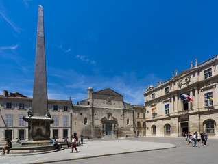 Fototapeta na wymiar Chapelle Sainte Anne and city hall, Place de la Republique with obelisk in Arles. Camargue, Buches du Rhone, Provence, France..