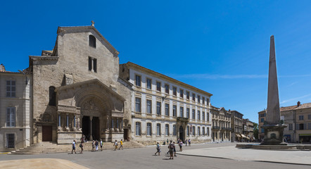 Fototapeta premium Cathedral Saint-Trophime, portal, Romanesque, UNESCO World Heritage Site, Place de la Republique with obelisk in Arles. Buches du Rhone, Provence, France..