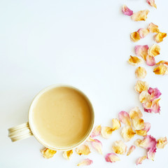 Picture of autumn background with dry roses and cup of coffee with copy space over white background