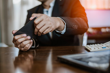 Businessman plying Video Games on his Smartphone During breaks.