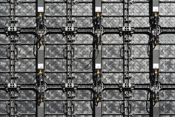 Texture of LED panels back view assembled in a large screen-monitor to show the city concert. View from the back of the LED panels. Big screen monitor display LED panels