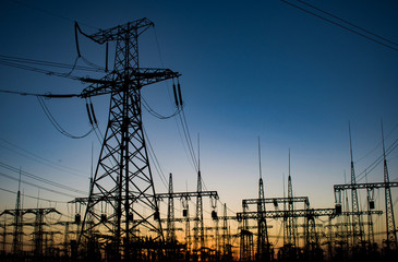 high-voltage power lines at sunset. electricity distribution station. high voltage electric transmission station