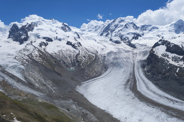 Distant steep rocky snow-capped alpine summit in Valais - Swiss Alps