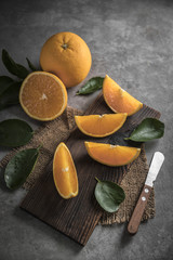 Beautiful, fresh orange on the dark background. Healthy sweet food concept.