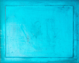 old turquoise painted wood background with frame