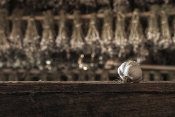 Garlic Cloves and Garlic Bulb on vintage wood background.