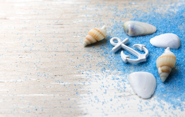 Fototapeta na wymiar Summer background,Blue sand and seashells on wooden background