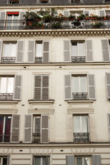 Paris residential buildings. Old Paris architecture, beautiful facades, typical french houses. Famous travel destinations in Europe. Background. City life, lifestyle and expensive real estate concept