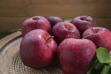 Fresh organic ripe apple fruits on old wooden table.