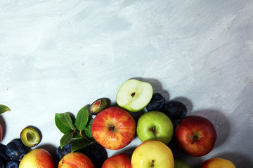 Various fresh fruits. Thanksgiving apples, and pears on rustic background.
