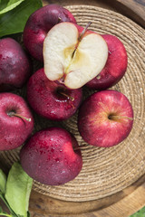 Fresh organic ripe apple fruits on old wooden table.