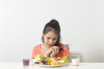  Woman does not like vegetable. Unhappy woman  does not like healthy food, Emotional face.