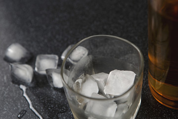Whisky and glass drop ice cubes, alcohol wallpaper.