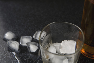 Whisky and glass drop ice cubes, alcohol wallpaper.