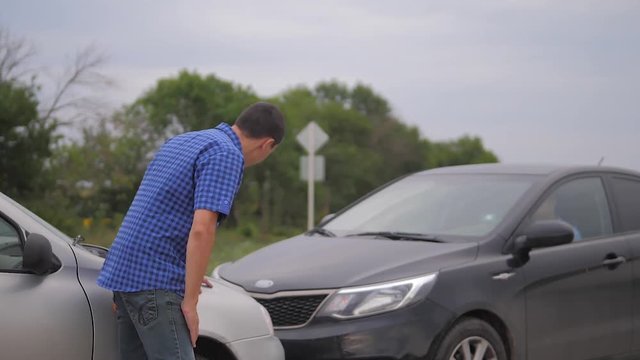 Two men arguing conflict after a car accident on the road car insurance. slow motion video. Two Drivers man Arguing After Traffic Accident. auto insurance accident concept men. Two men reporting a car