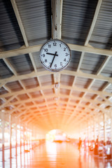 clock in the train station on background.