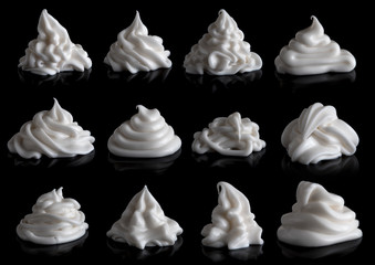 Whipping cream cake or sour cream isolated on black background