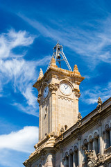 Tower with clock of Municipal Council of the District of Sants-Montjuic in Barcelona, Spain.