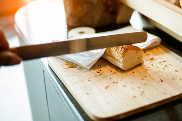 Bread on Slicing board with knife.breakfast.