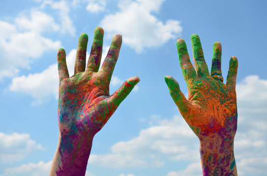painted hands with holi colors