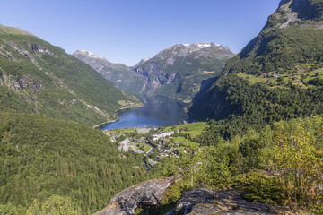 Naklejka na ściany i meble Beautiful view of Geiranger fjord and valley from Flydalsjuvet Rock
