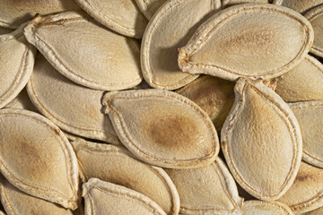 Roasted  pumpkin  seeds, food background, close- up, view from above.