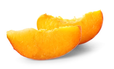Fototapeta na wymiar Slices of fresh sweet peach on white background