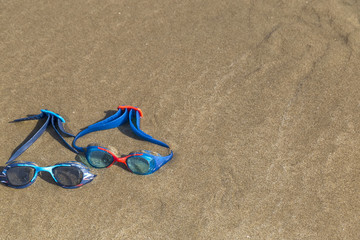 swimming glasses on the beach