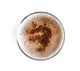 Glass of cold tasty beer on white background, top view