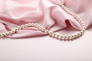 Pearl necklace with pink satin fabric